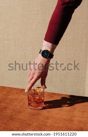 Negroni, an italian IBA cocktail with gin, bitter and vermouth; in luxury elegant home, homemade drink Royalty-Free Stock Photo #1951611220