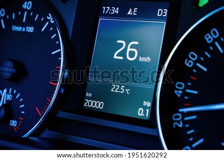 Close-up macro shot of new car dashboard computer display with 20000 kilometers mileage Royalty-Free Stock Photo #1951620292