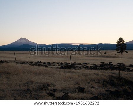 mountain and plains landscape at sunset
