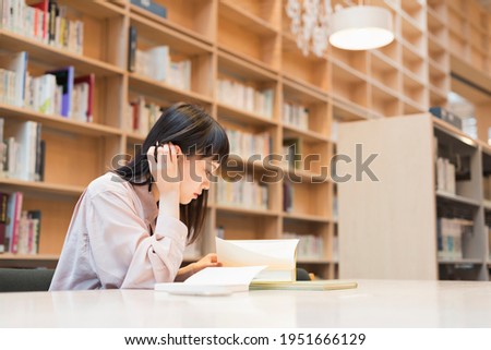Female college student in the library