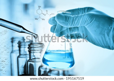 Flask in scientist hand with Test tubes Royalty-Free Stock Photo #195167519