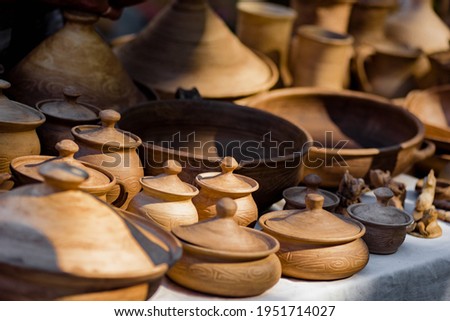 Traditional ceramic pots and bowls for sale in street market, small business, outdoor street sale in the context of the coronavirus pandemic lockdown
