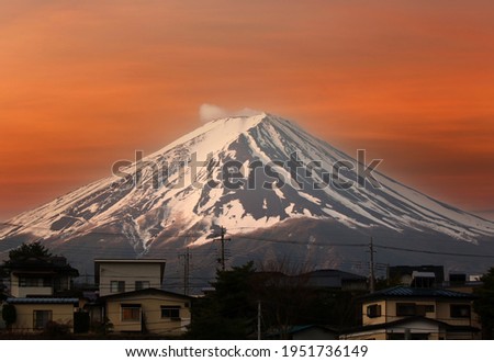 Fuji and the city view in the evening on twilight sky background,View of Fujisan and Kawaguchiko City. Royalty-Free Stock Photo #1951736149