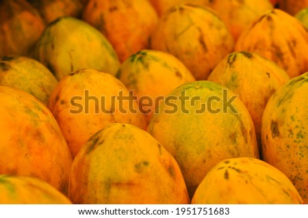 fresh papayas in fruits shop
