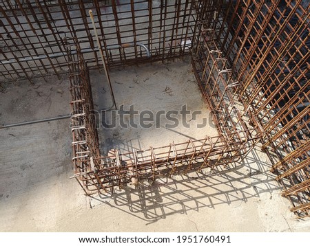 Rusted rebar prepared for construction.