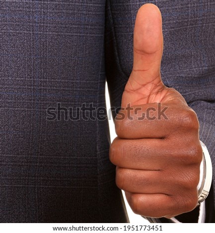 businessman showing thumbs up hand gesture on whit background stock photo