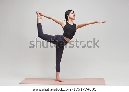 Asia korean gorgeous young woman.  practicing yoga indoor. Beautiful girl practice pose in class. Calmness and relax, female happiness.Horizontal, white background