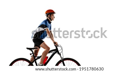 Young Caucasian boy bike rider with road bike isolated over white background.