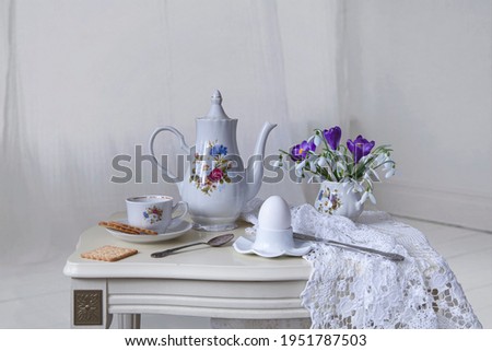 Still life with spring breakfast on a white table