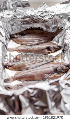 Raw flounder fish, seafood on baking foil. Healthy eating concept.