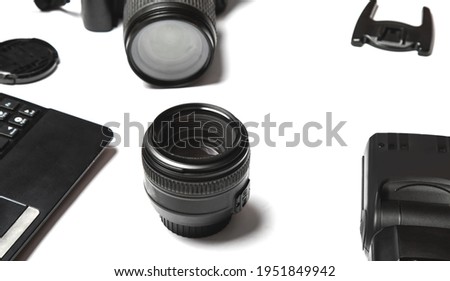 The tools of the trade for a professional photographer. copy space. white table background