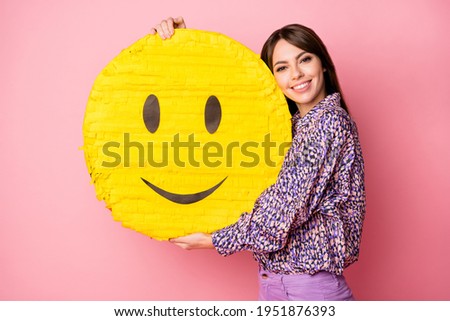 Photo of young charming pretty happy cheerful smiling girl hug big yellow smile emoji isolated on pink color background