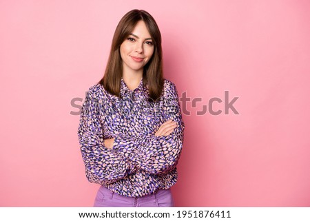 Photo portrait of girl with crossed arms isolated on pastel pink colored background