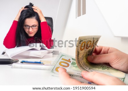 Woman upset at home value. Concept - loss of money invested in the of real estate. Sad girl next to the documents. Money in the hands of man. Concept - increase in construction costs. Realtor.