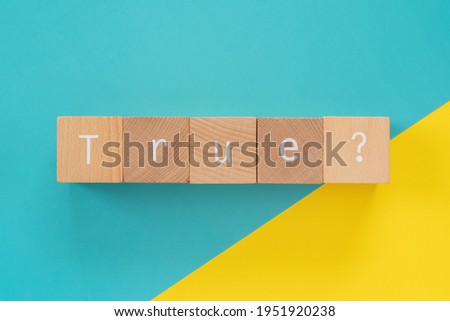 True?; Five wooden blocks with "True" text of concept. Royalty-Free Stock Photo #1951920238