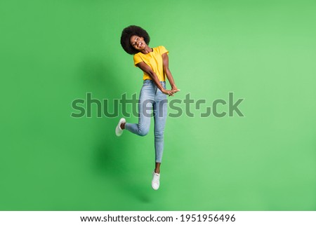 Full length body size photo of jumping girl cute nice childish isolated on vivid green color background