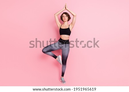 Full length photo of relaxed calm young woman yoga pose pilates sport isolated on pink color background