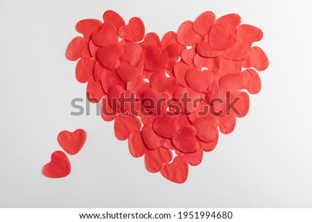 Symbol of happiness, love, health in the face of a big heart consisting of small hearts on a white background