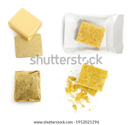 Set with bouillon cubes on white background, top view
