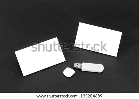 Business card template mockup for branding identity or contact information drawing with blank modern devices. Ready to print modern abstract design or hipster logo. Isolated on black paper background.