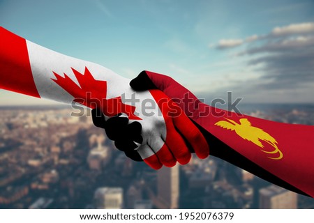 Shaking Hands Canada and Papua 