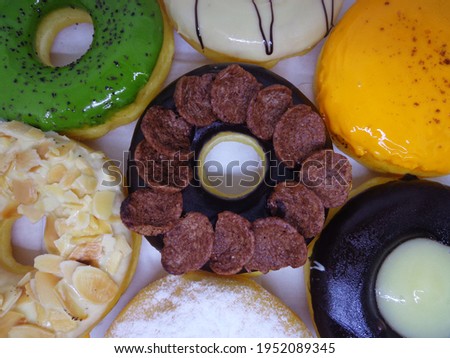 Picture of various donuts on a white background