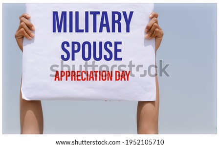 Military Spouse Appreciation Day banner in hand in sky background with text