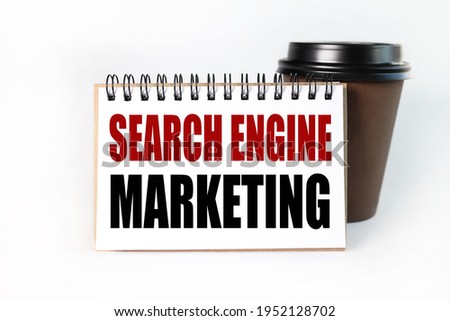 SEM - Search Engine Marketing. Text on white notepad paper on light background