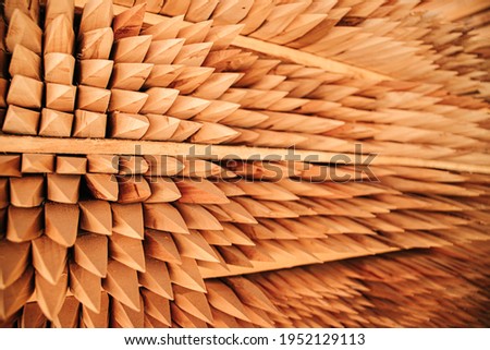 Wooden stakes stacked in the warehouse of a lumber company Royalty-Free Stock Photo #1952129113