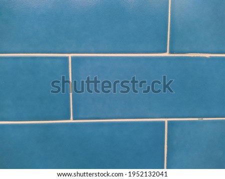blue tile with white seams closeup photo