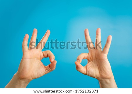 gesture and body parts concept - man hands showing ok sign
