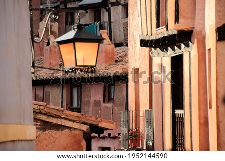 Irregular traditional constructions of masonry, wood and red plaster in Albarracín (Teruel)