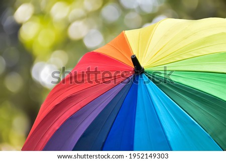 Closeup view of rainbow colors umbrella with clipping paths. Lgbtqai and pride month concept, soft and selective focus.