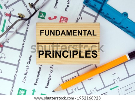 Business card with text Fundamental Principles on a construction drawing. Concept photo