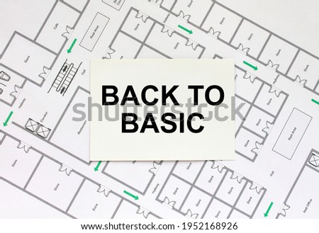 Business card with text Back To Basic on a construction drawing. Concept photo