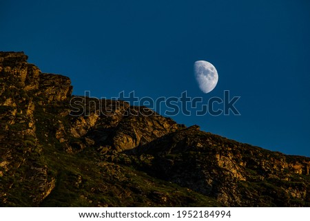 moon over the mountain at noon