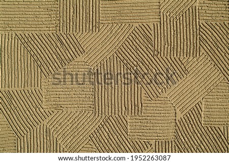 decorative plaster on the wall, brown background