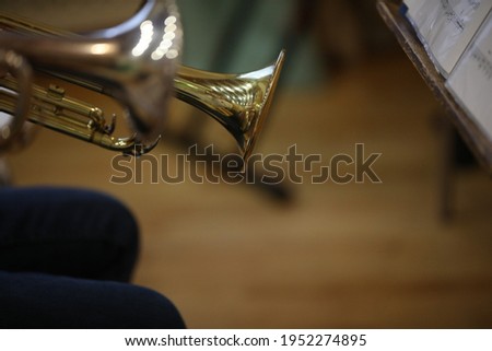 Fragment of a musical trumpet gold bell with notes.Background Image.Art Shot