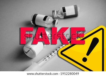 Concept of Covid Vaccines fake news and hoax. False information. Danger sign. Spread of lies around laboratories and vaccines for coronavirus. Speculation and misinformation about medical solutions.  Royalty-Free Stock Photo #1952280049