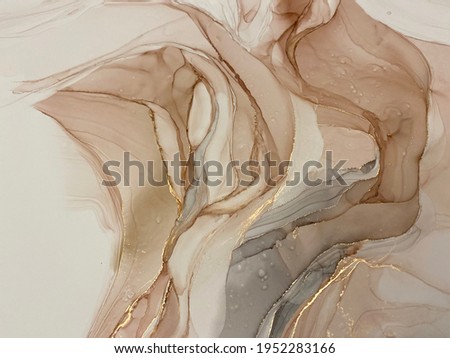 Abstract beige art with gold — pink background with brown, beautiful smudges and stains made with alcohol ink and golden pigment. Beige fluid art texture resembles petals, watercolor or aquarelle.

