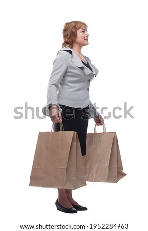 Caucasian senior woman holding gift bags