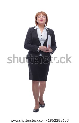 Adult female in black suit holding papers in her hand, isolated on white