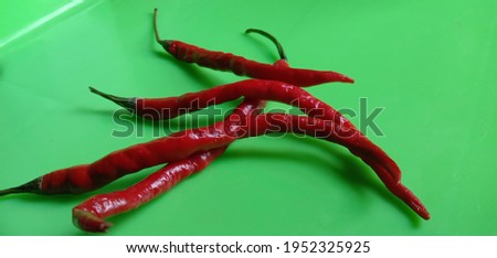 This is a multi-sided photo of red chilies