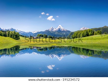 Idyllic summer landscape with clear mountain lake in the Alps Royalty-Free Stock Photo #195234572
