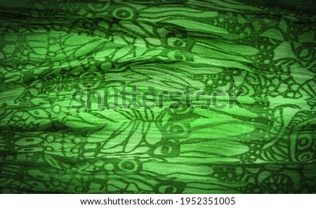Dark green silk fabric, floral pattern. Wavy corrugation. Fine wave on the surface of the fabric. Background texture, decorative ornament