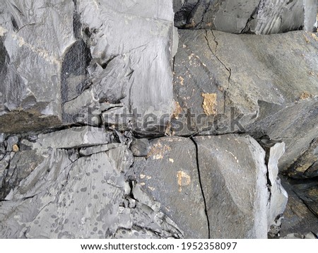 Close up of dark gray volcanic rock texture wall at Buri Ram Thailand