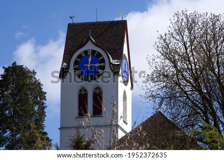 Church tower of protestant church of village Hinwil, Switzerland. Photo taken April 8th, 2021.