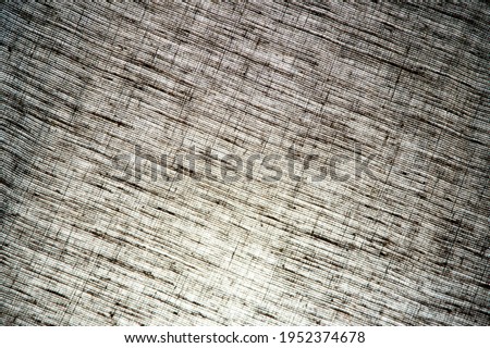 abstract rough light linen natural fabric background, short focus