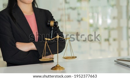 Golden scales scales of uncle justice and female lawyer are background