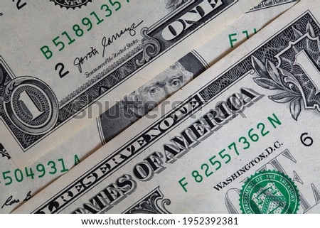 Thomas Jefferson peeking through 1 dollar banknotes for design purpose